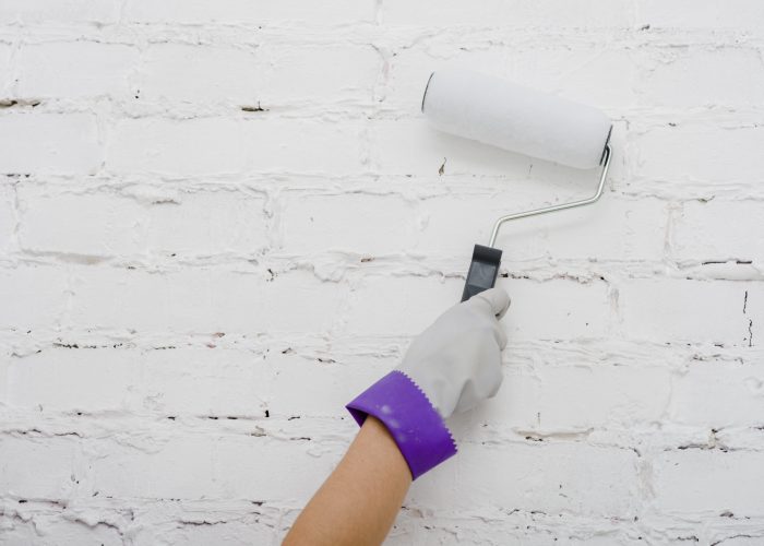 crop-hand-painting-wall